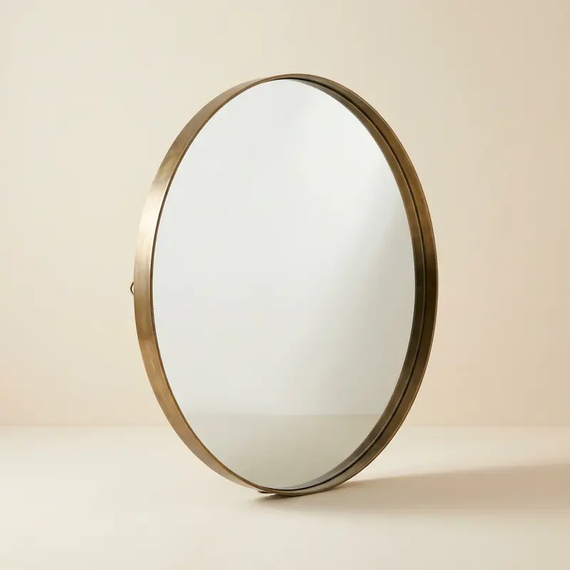 Calder round mirror, 30 in in Aged brass