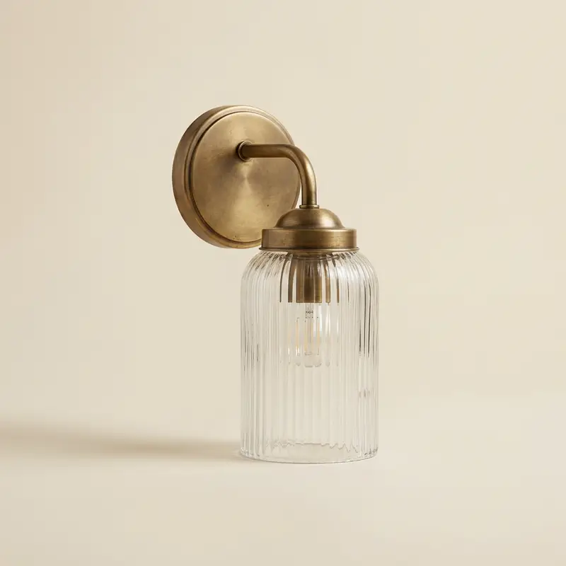 Ellis ribbed glass bath sconce in Aged brass